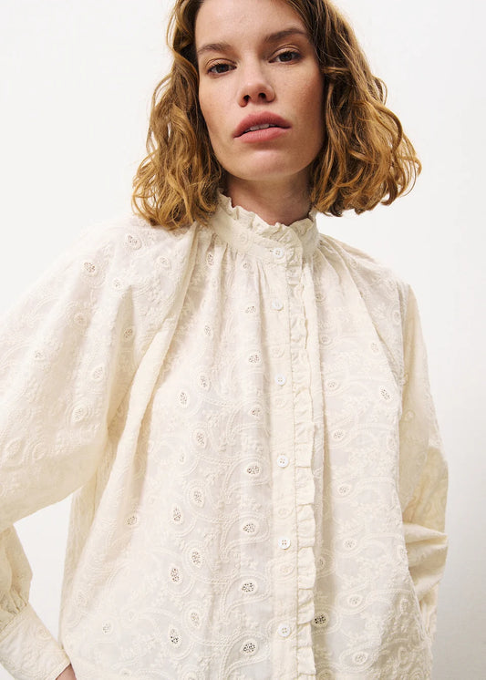 Cropped shirt, short and voluminous cut • Ruffles on the button placket and collar • Embroidered fabric.


Fit: Loose fit
Composition : 100% Cotton
Colour: Ecru
The Beach House Boutique, Rock, Cornwall. 