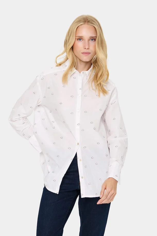 This classic white shirt features a playful dotted pattern with small black clouds, adding a subtle, unique twist. The shirt has a relaxed fit, front button closure, classic collar, and a rounded hem, making it both versatile and stylish.


Fit: Oversize fit
Length: 76.75 cm corresponds to size S
Composition : 100% Cotton

Colour: Ice Clouds

The Beach House Boutique, Rock, Cornwall. 