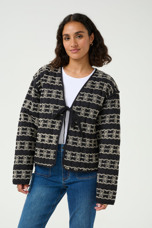 Black quilted tie front jacket embroiled pattern repeated in stripes over the garment. Drop shoulder style.
Fit: Regular fit
Composition: 100% Cotton
Colour: Black
The Beach House Boutique, Rock, Cornwall.