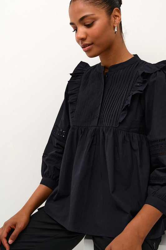 Fit: Loose fit blouse. 3/4 length sleeves. Front panelling. Buttons extend to chest. Frills from chest to shoulders. 
Length: 62 cm corresponds to size 36
Composition : 100% Cotton
Colour: Black
The Beach House Boutique, Rock, Cornwall. 
