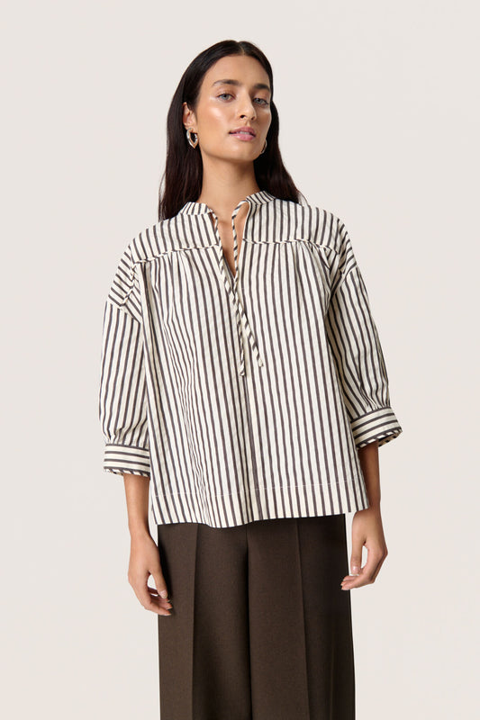 Blouse with classic stripes and a relaxed, timeless silhouette. Wide cuffs and contrast stripes at the sleeves.

Fit: Loose fit
Sleeves: Long sleeve
Fabric Composition:80% Cotton, 20% Polyester
Colour: White &amp; Chocolate Torte Stripe.
The Beach House Boutique, Rock, Cornwall. 