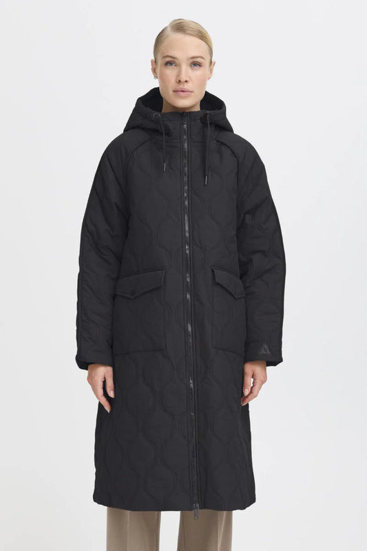 Quilted with a cosy, insulating layer to keep you warm. A hood with a drawstring. Deep patch pockets with a separate side "handwarmer" opening. The sleeves have a deep recessed rib cuff and there is a practical two way zip. The outer fabric will keep you dry in a light shower but is not waterproof.

Fit: Roomy.
Colour: Black.
Composition: 100% Polyester.
Care: 30º machine wash
The Beach House Boutique Rock, Cornwall